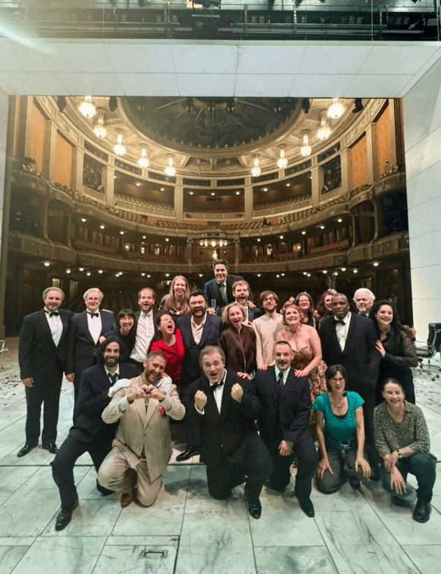 Levente Török with the cast and team of La Cenerentola on stage at Staatsoper Stuttgart